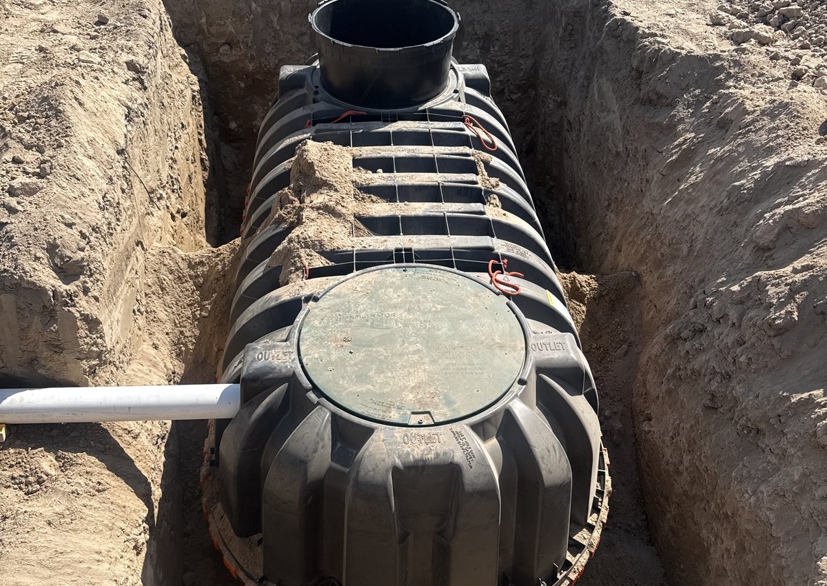 New septic tank set in an excavated trench on a Treasure Valley septic installation