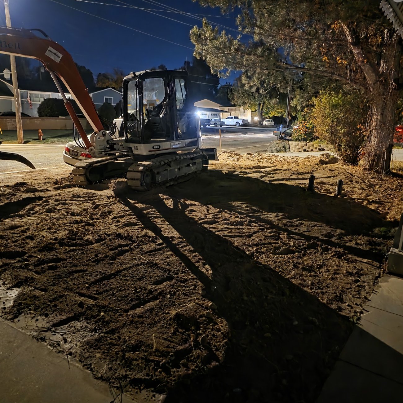 Site excavation and grading work on a Nampa job at dusk