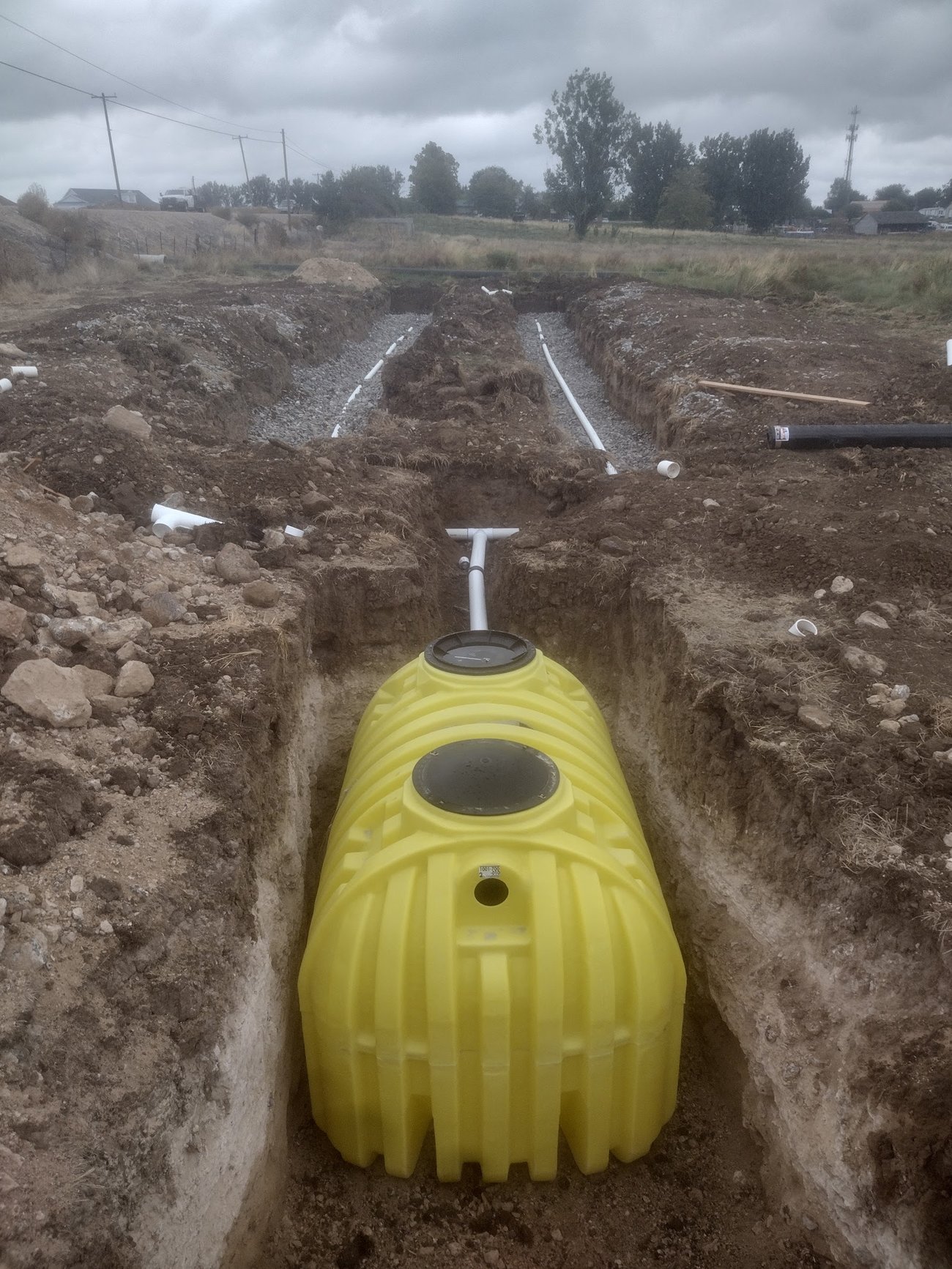 Gravelless septic dome set in an excavated drainfield